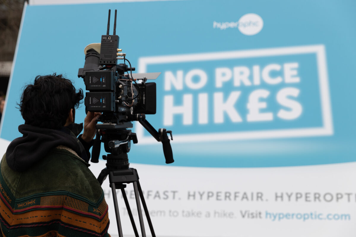 Over the shoulder photograph of camera operator filming branded content